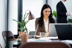 close up woman working laptop