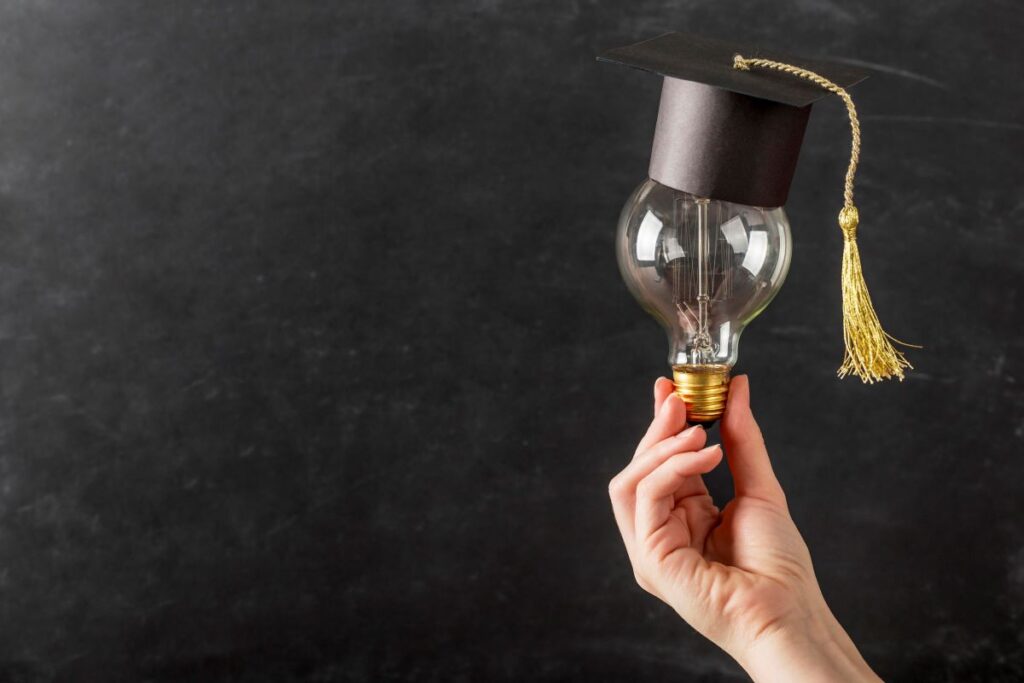 person-holding-light-bulb