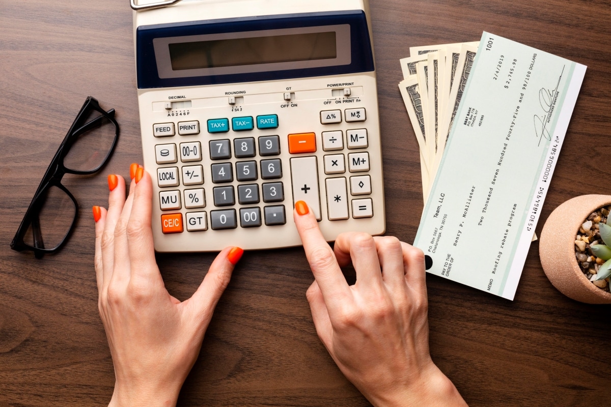 close-up-hands-using-calculator