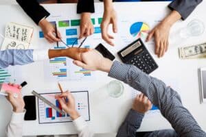 businessmen-hands-white-table-with-documents-drafts
