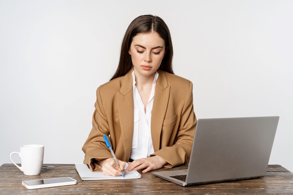 table-with-laptop-writing-documents